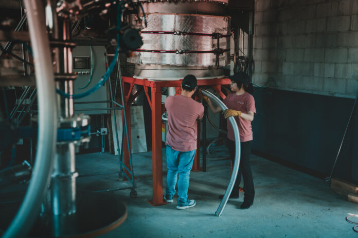 Ten-Nine Tech engineers operate pilot-scale production equipment at the company's Tulsa, Oklahoma facility